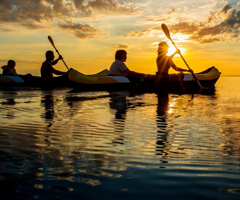 family kayaking together